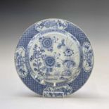 A Chinese Export porcelain blue and white charger, 18th century, with chrysanthemum and further