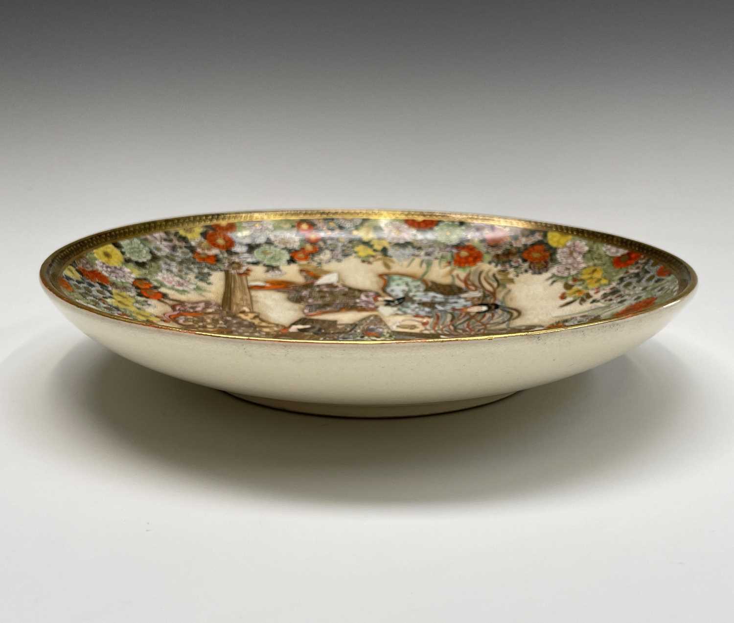 A Japanese Satsuma plate by Ryuzan, Meiji Period, gilt decorated with geisha in a garden setting, - Image 4 of 16