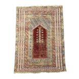 A Kuba prayer rug, North East Caucasus, mid 19th century, the madder mihrab with saffron and pale