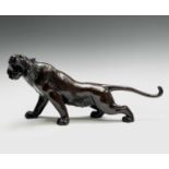 A Japanese bronze model of a tiger, Meiji Period, signed, height 24cm, length 52.5cm. Provenance: