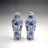 A pair of Chinese porcelain blue and white baluster vases and covers, late 19th century, each