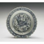 A Chinese blue and white dish, Ming Dynasty, depicting a Qilin to the centre and character marks