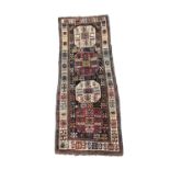 An Akstafa runner, North East Caucasus, circa 1880, the charcoal field with four octagonal ivory and