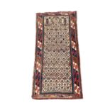 A Fine Shirvan Prayer rug, South East Caucasus, the ivory trellis mihrab with stylised plants and