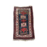A Karachov Kazak dated rug, circa 1910, the green and blue abrash field with five madder and ivory