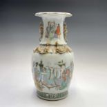 A Chinese famille verte porcelain baluster vase, 19th century, decorated with figures within an