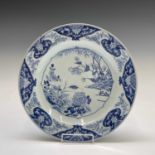 A Chinese Export porcelain blue and white charger, 18th century, with bamboo, chrysanthemum and
