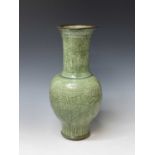 A large Chinese longquan celadon vase, Yuan Dynasty, decorated with scrolling leafy vines, height