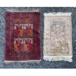 An Afghan rug, 127 x 80cm and a Turkish art silk prayer rug, 103 x 64cm, each circa 1930-1950.