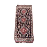 A small Ghashghai rug, South West Persia, circa 1920, the indigo field with a madder triple linked