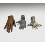 Three assorted mannequin hands, the largest 21.5cm long.