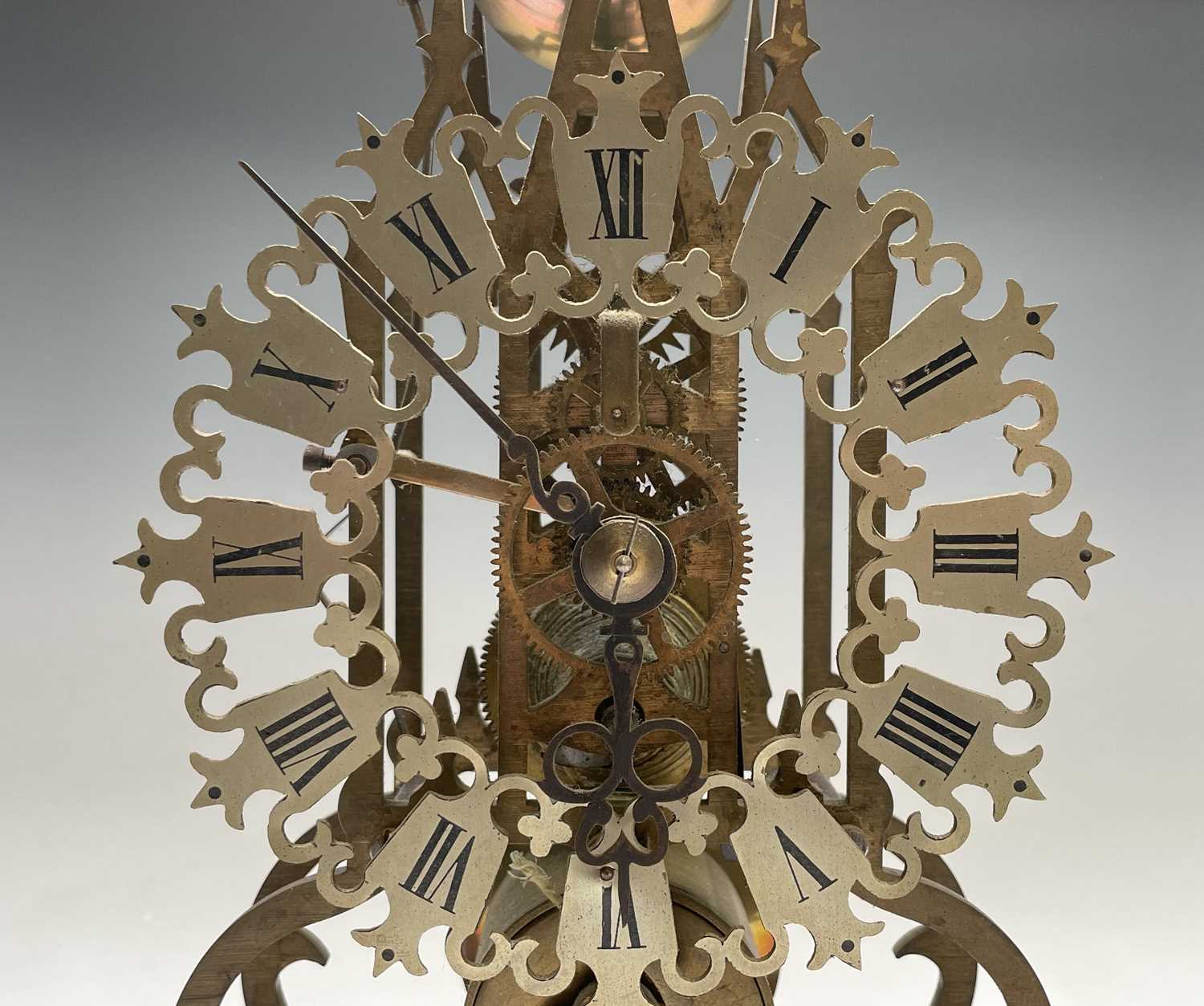 A brass cathedral skeleton clock, 20th century, with single fusee movement, striking on a bell, - Image 7 of 8