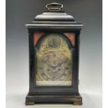 A mid 18th century ebonised bracket clock, the arched dial signed Thos Colley, with twin fusee