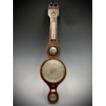 A George III mahogany wheel barometer, signed H. Semmons, Truro. Length 96.5cm. Provenance:Michael