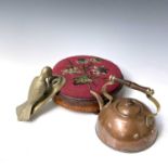 A Victorian inlaid walnut circular footstool with floral beadwork top, 27cm diameter, a copper