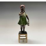 After Juan Clena, a painted bronze sculpture of a girl standing on a stool. Height 37cm.