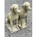 A pair of Churchstone (limestone, sandstone and granite) garden figures of pointers, modern,