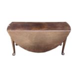 A George III mahogany dropleaf dining table, raised on five turned legs, with pad feet, height 72cm,