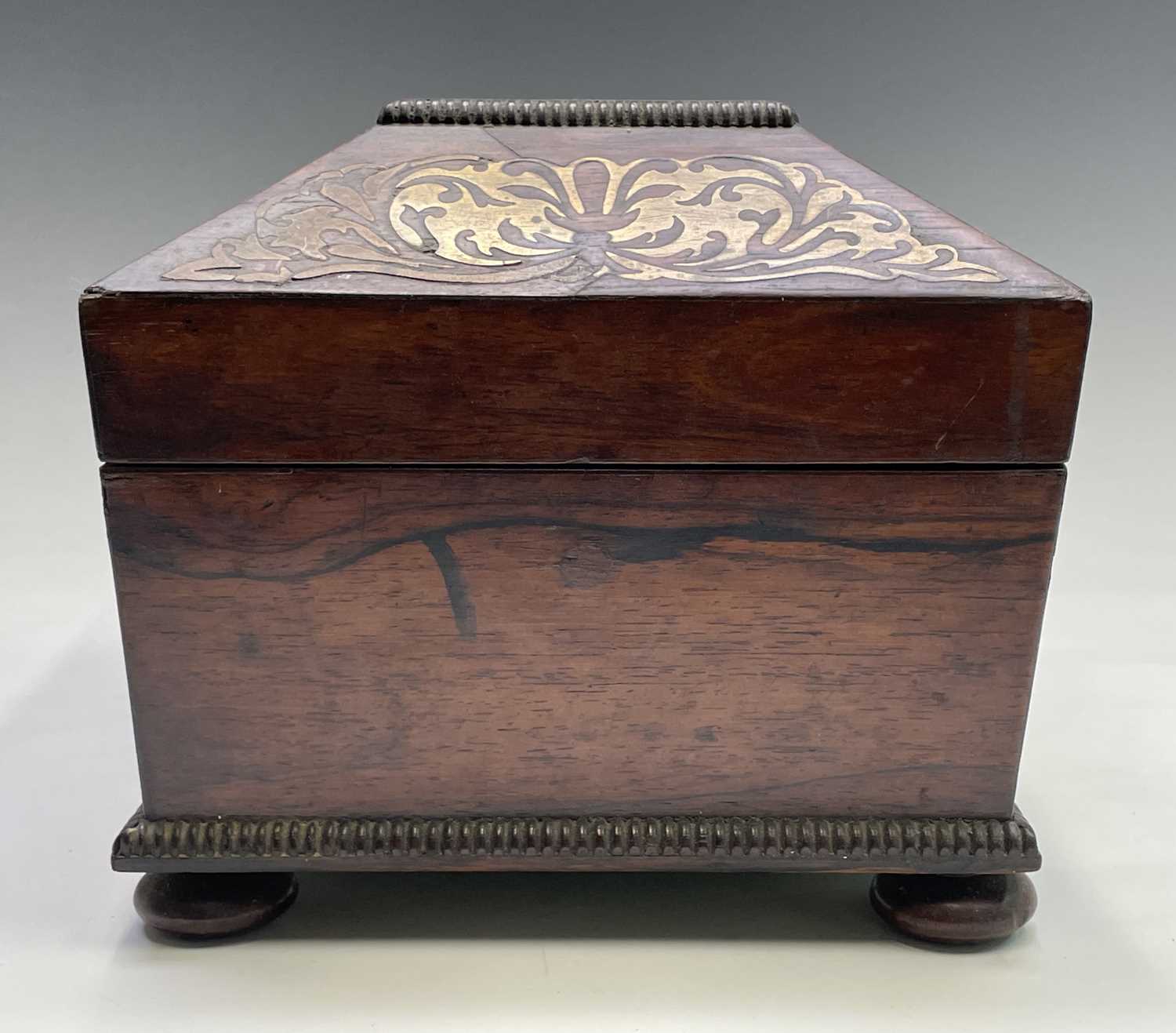 A Regency rosewood and cut brass inlaid box or casket, raised on bun feet, width 30cm. Provenance: - Image 2 of 6