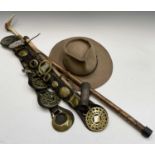 An Australian Akubra hat, together with other items including horse brasses, a whip and a horn