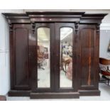 A Victorian mahogany triple wardrobe, overall height 218cm, width 265cm, depth 82cm.Condition