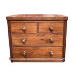 A late Victorian mahogany chest of small proportions. Height 80cm, width 96cm, depth 44.5cm.