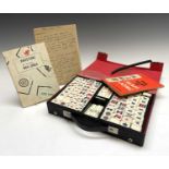 A Dragon mah jong set, with bamboo backed tiles and complete with instructions, width 28.5cm.