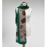 A Gucci 'Gucci Blooms' design silk scarf, with tags. 89 x 181cm.Condition report: As new condition