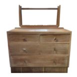 A 1930s/40s limed oak dressing table with adjustable mirror, fitted two short and two long