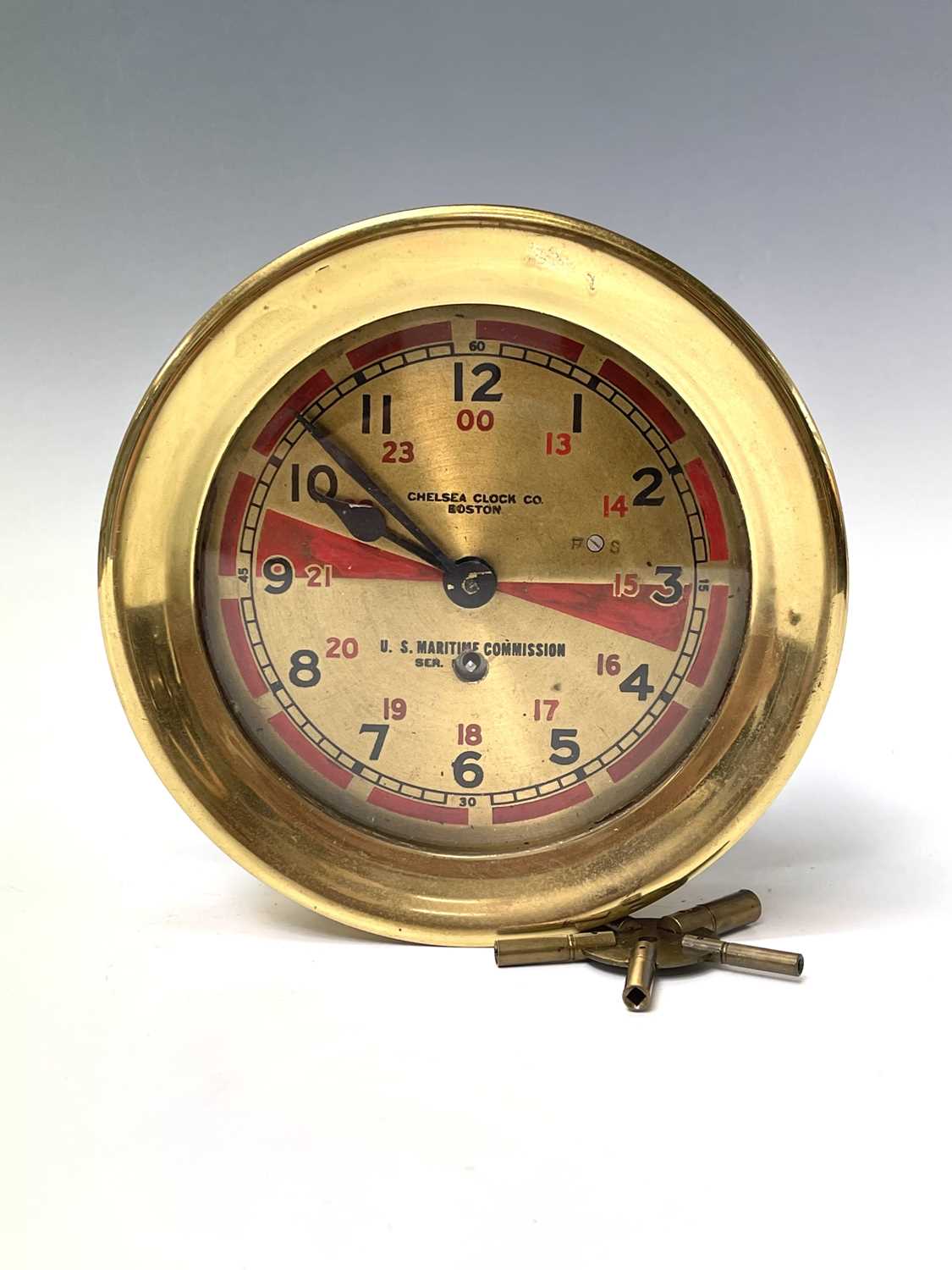 A U.S. Maritme Commision ship's radio room clock, by The Chelsea Clock Co, Boston, the brass dial