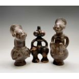 Two African (Mangbetu) pottery figural vessels, the tallest 27cm high, and one other pottery