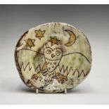 A Ben Fosker (b.1960) slip decorated earthenware plate painted with an owl, painted 'B' mark