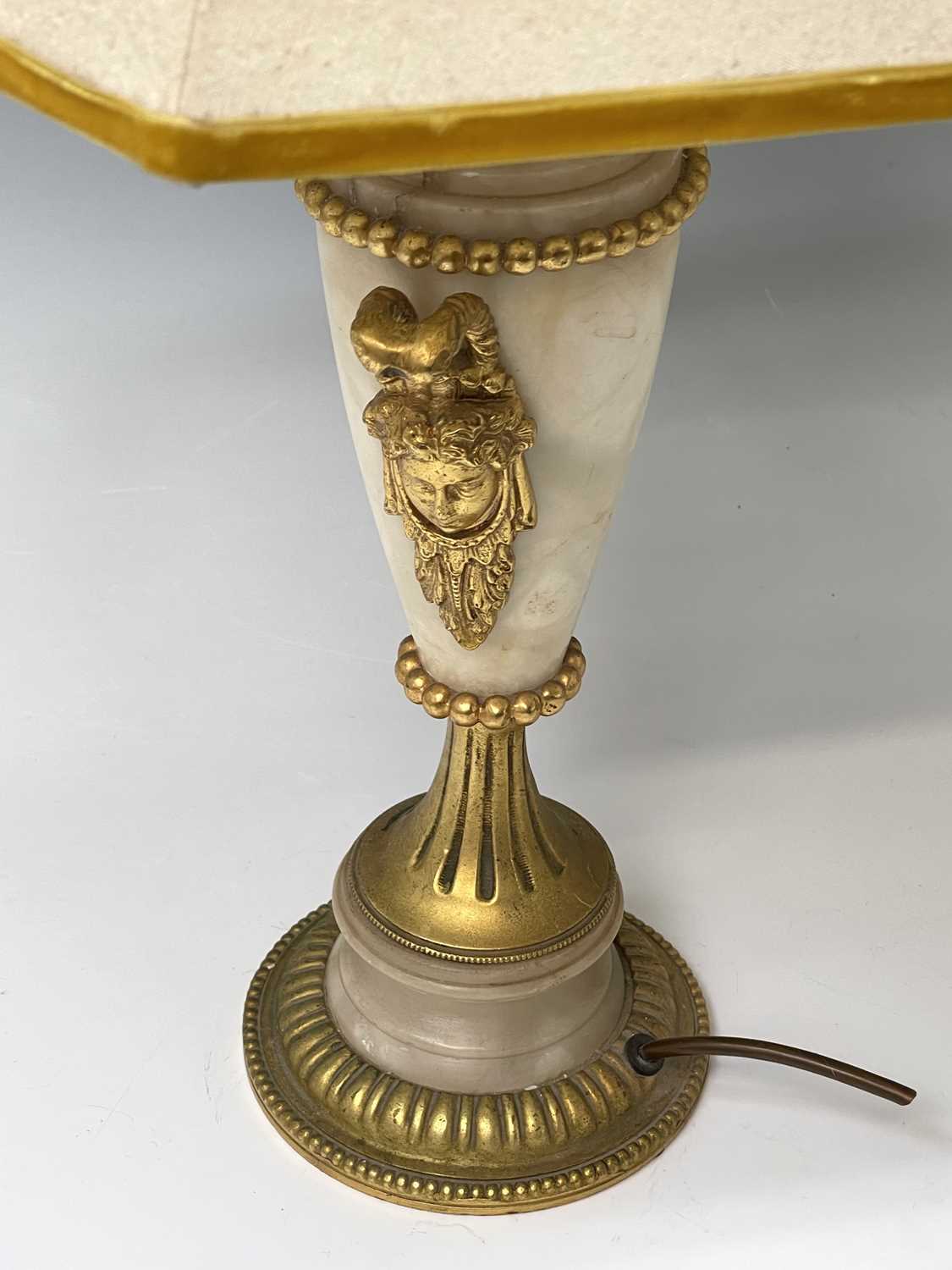 An ornate alabaster table lamp, early 20th century, with gilt metal mask handles and mounts, - Image 2 of 4