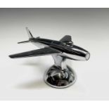 A Dunhill 'Sabre' jet fighter table lighter, 1950s, with chrome finish, on a domed base, length 16.