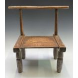 A late 19th/ early 20th century primitive chair, Ivory Coast, Dan Tribe, height 55cm.