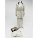 A ladies Edwardian cream wool suit, cream silk lined, of a jacket and skirt with embroidered