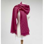 A Louis Vuitton pink monogram design cashmere and wool blend scarf, with tags. 70 x 182cm.