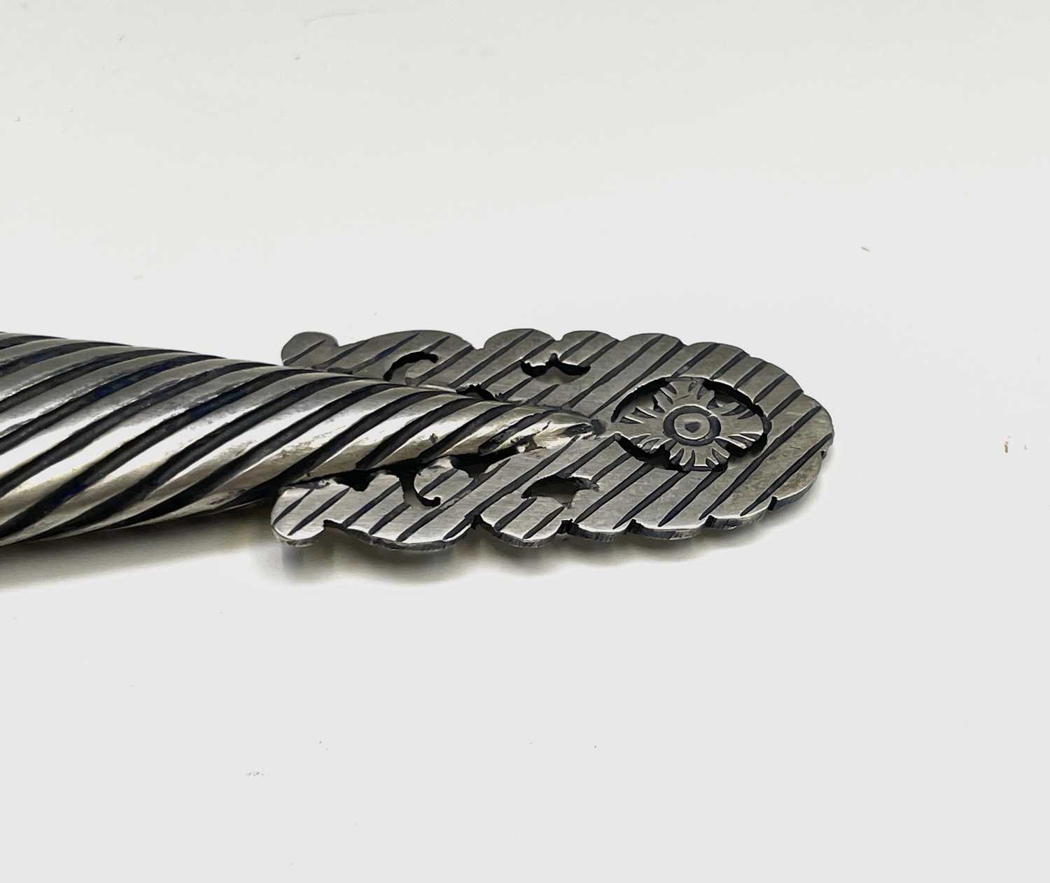 An Argentinian gaucho knife, mid 20th century, with spiral white metal grip and similarly - Image 9 of 9