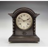 An oak cased mantel clock, with twist side supports, British Jerome movement, height 30cm.