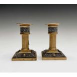 A pair of late 19th/early 20th century Walker & Hall Celtic Revival gilt bronze candlesticks, having