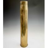 A tall brass shell case from a Vickers 3.7" HAA gun, stamped marks and dated 1951 to the base,