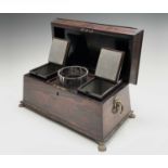 A Regency rosewood tea caddy, of sarcophagus shape, with a glass mixing bowl and two lidded