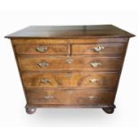 An 18th century walnut and chequer strung chest of two short and three long drawers on bun feet,