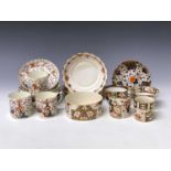 Three Derby porcelain coffee cans and saucers, circa 1820, painted in iron red, blue, green and gilt