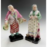 A remarkable pair of 19th century porcelain figures, probably Russian, of a man and a woman, in