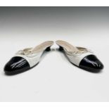 Chanel Shoes. Classic Chanel two tone kitten heel mules. White leather, with white bow, silk trim