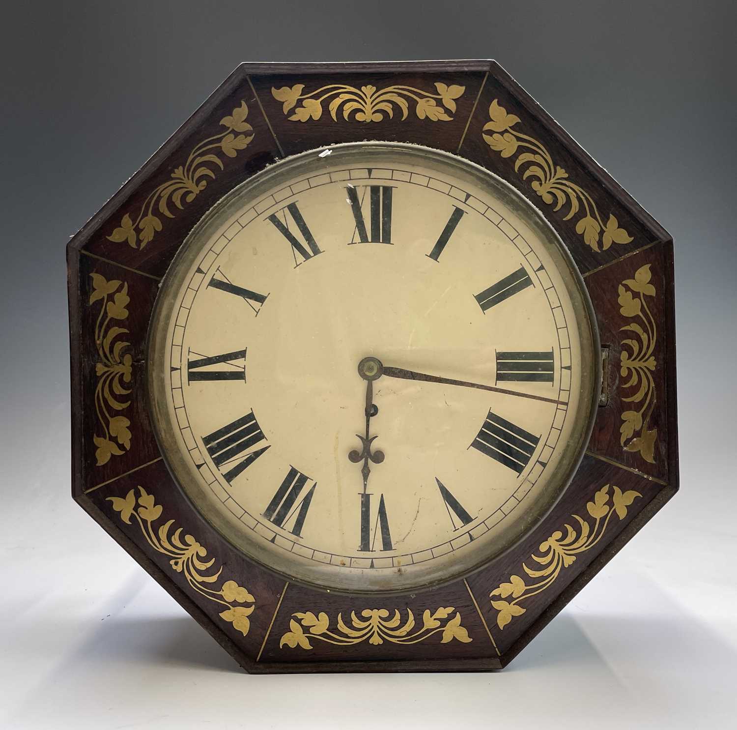 An early Victorian rosewood and brass inlaid octagonal wall clock, with fusee movement, width 42cm.