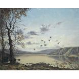 Nigel HALLARD (1936-2020) a flock of ducks in flight on an autumnal day, oil on canvas, signed,