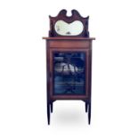 An Edwardian mahogany and satinwood banded music cabinet, with raised mirrored back above a glazed