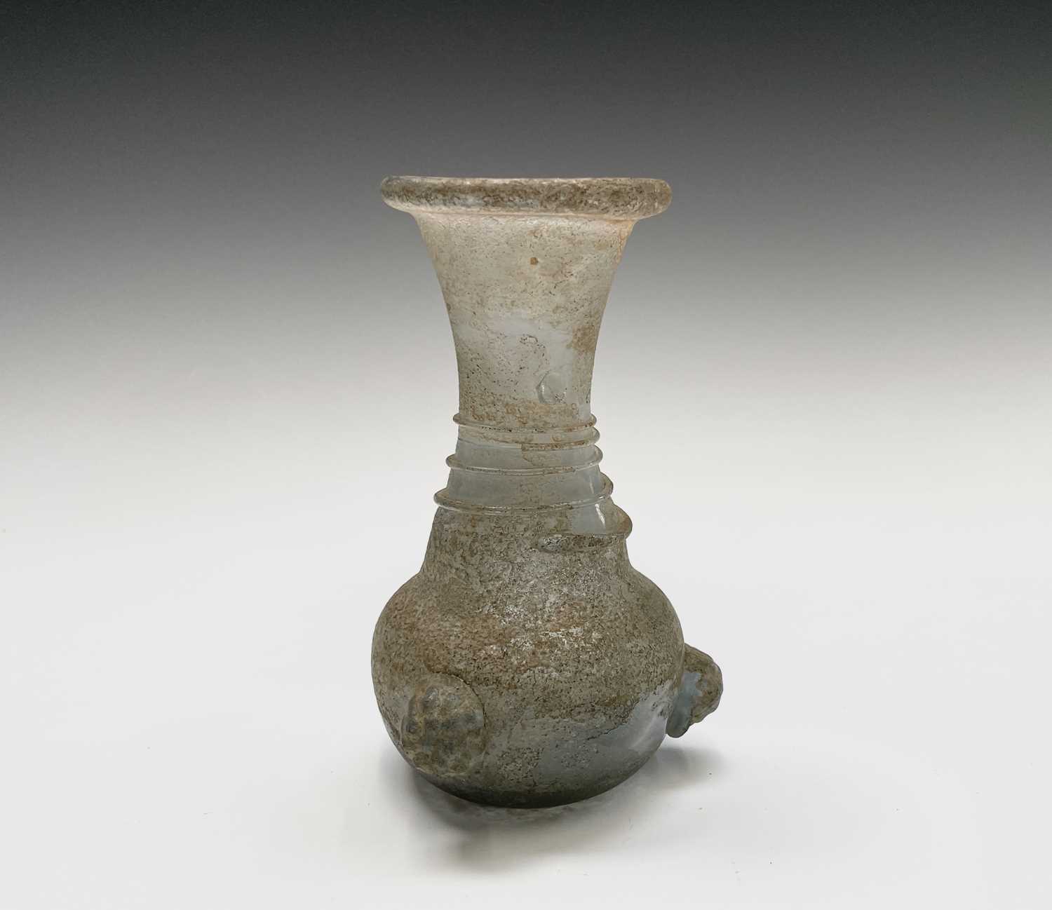 Three iridescent glass vessels, possibly Roman, comprising a ewer, height 13cm, and two vases. - Image 12 of 16